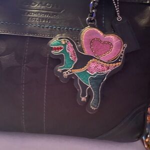 Coach Black Bag with Pink and Green “REXY” Dinosaur Charm
